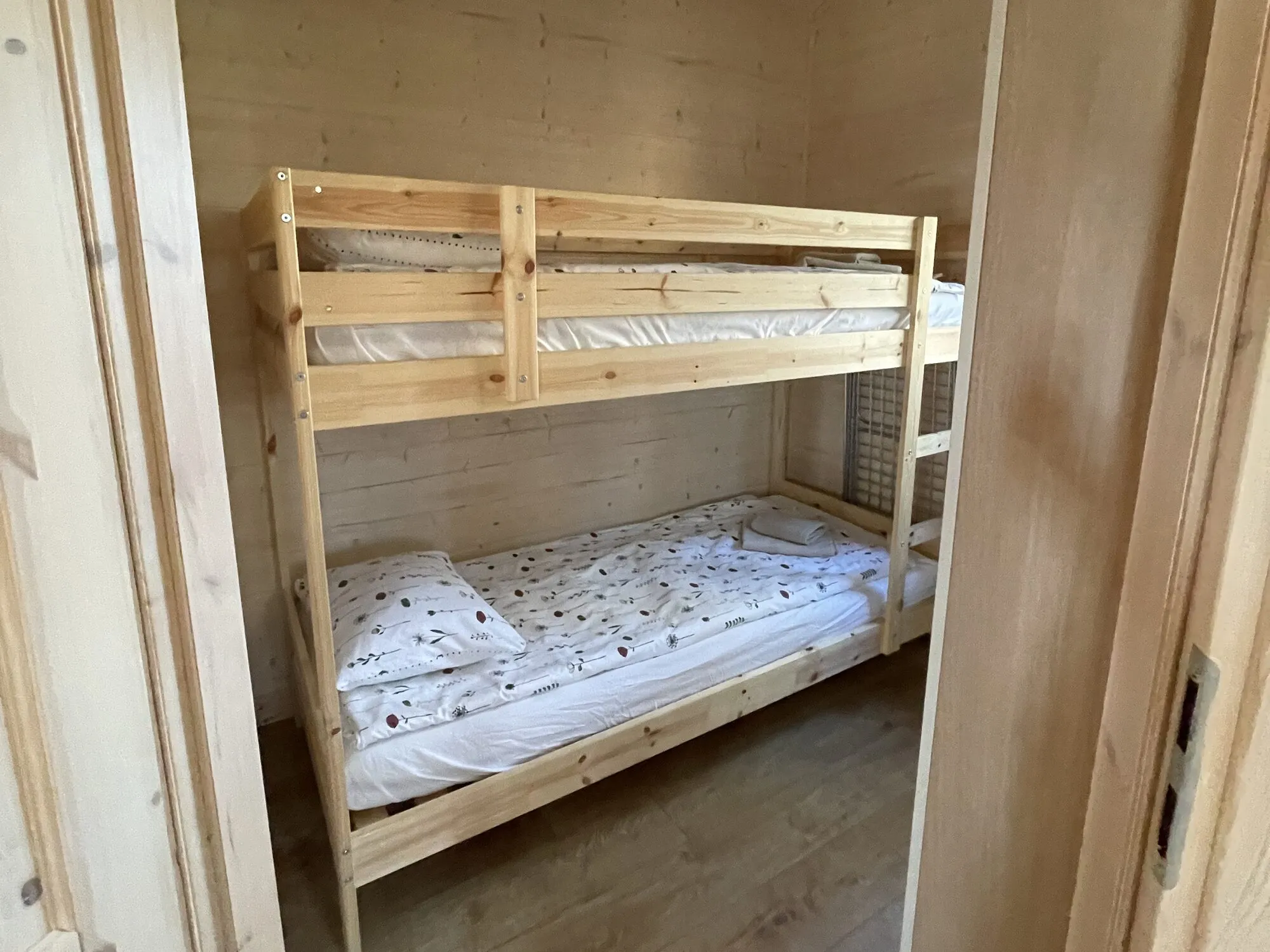 Small bedroom with a bunk bed for children in the Forest cabin