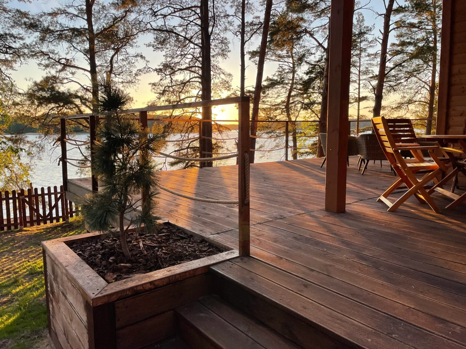Panorama cabin terrace in Borsk at sunset, Lake Wdzydze in the background