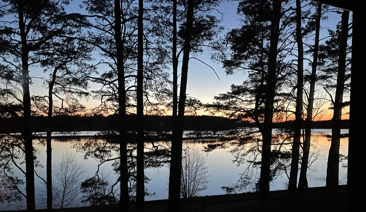 Sunset over Lake Wdzydze seen from the Panorama cabin plot in Borsk